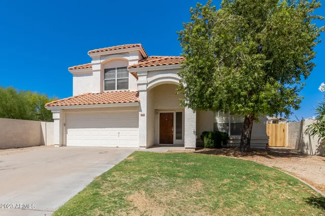 a view of an empty room with a chandelier