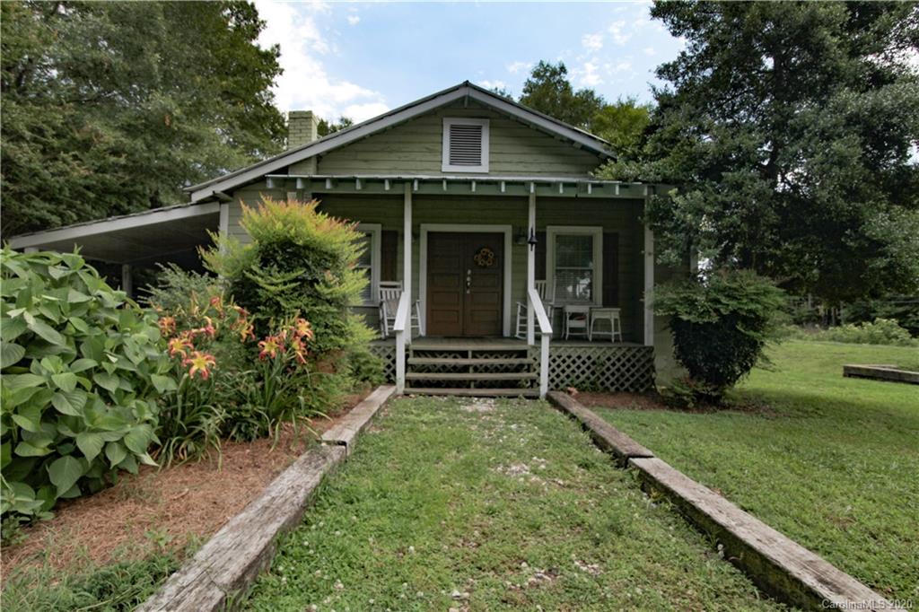 15 Big Level Road Mill Spring, NC 28756 - Photo 2 of 20 a front view of a house with a yard