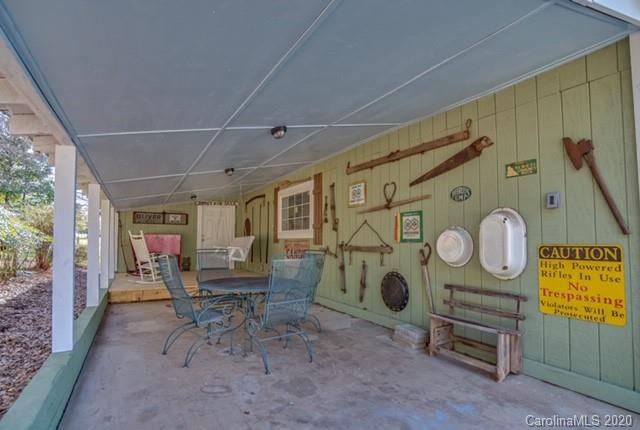 15 Big Level Road Mill Spring, NC 28756 - Photo 16 of 20 a living room with furniture and a clock