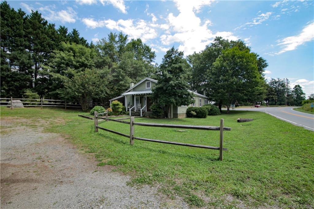 15 Big Level Road Mill Spring, NC 28756 - Photo 19 of 20 a house view with a garden space