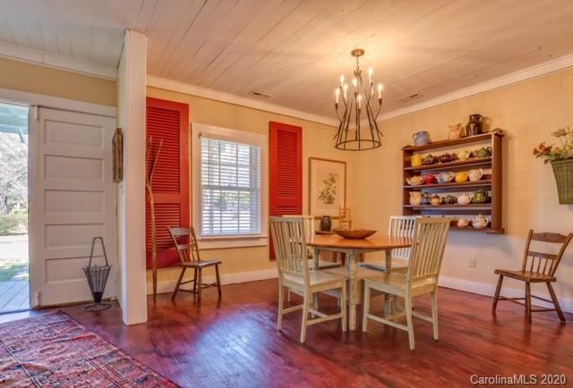 15 Big Level Road Mill Spring, NC 28756 - Photo 4 of 20 a view of a dining room with furniture window and wooden floor