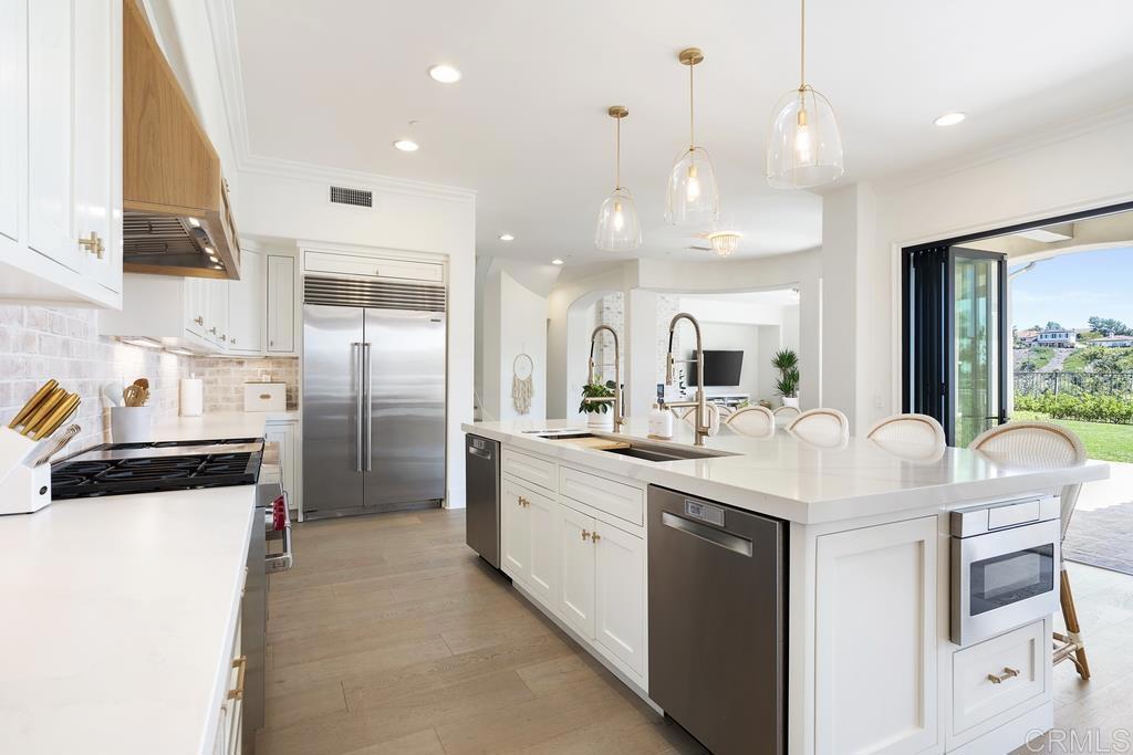 8 Corte Vizcaya San Clemente, CA 92673 - Photo 12 of 62 a kitchen with stainless steel appliances granite countertop a sink a stove and a refrigerator