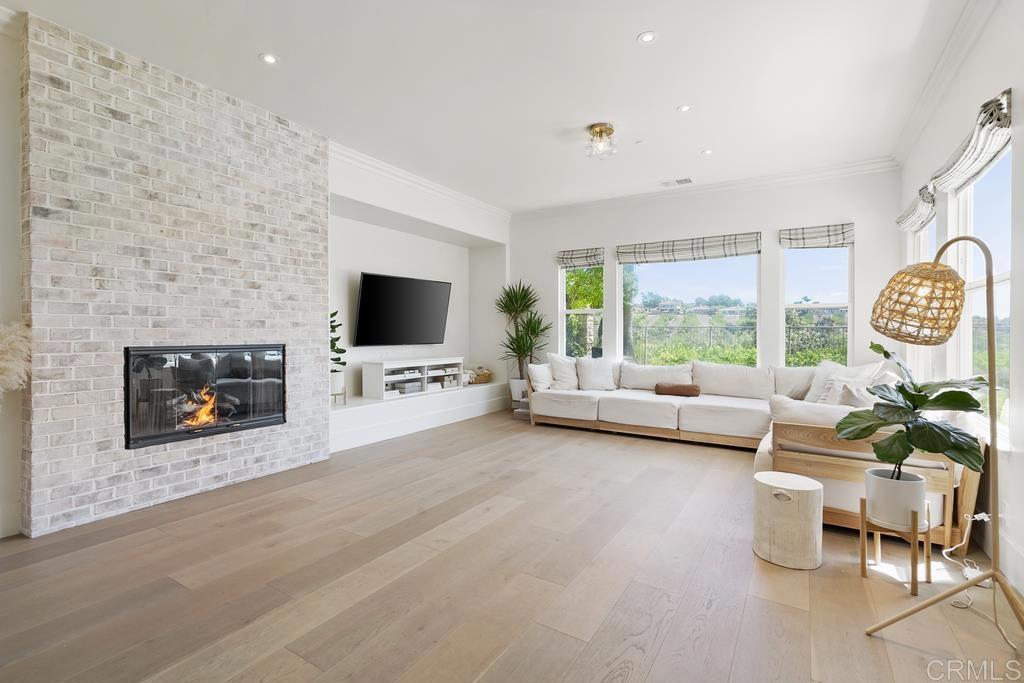 8 Corte Vizcaya San Clemente, CA 92673 - Photo 18 of 62 a living room with furniture a flat screen tv and a fireplace
