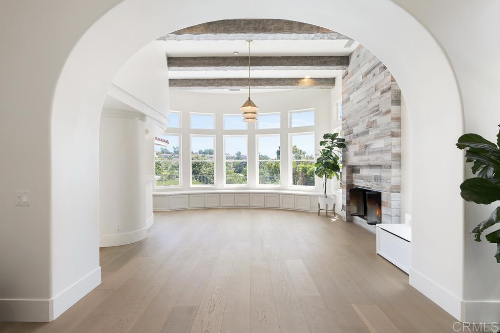 8 Corte Vizcaya San Clemente, CA 92673 - Photo 23 of 62 wooden floor fireplace and windows in an empty room