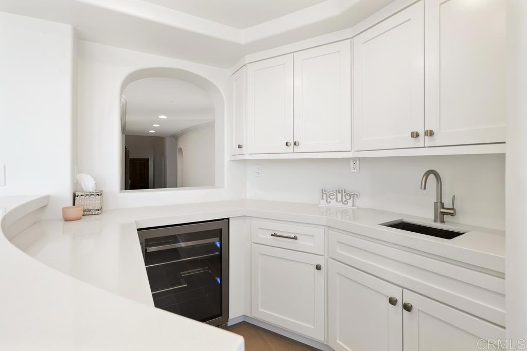 8 Corte Vizcaya San Clemente, CA 92673 - Photo 25 of 62 a kitchen with white cabinets and sink