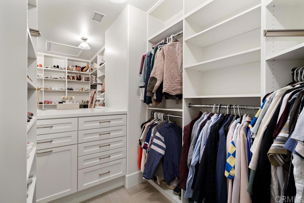 8 Corte Vizcaya San Clemente, CA 92673 - Photo 36 of 62 a view of walk in closet with clothes and shoes