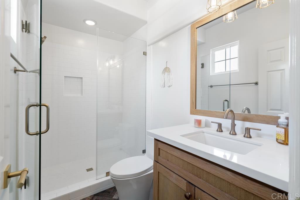 8 Corte Vizcaya San Clemente, CA 92673 - Photo 41 of 62 a bathroom with a granite countertop sink a toilet and shower