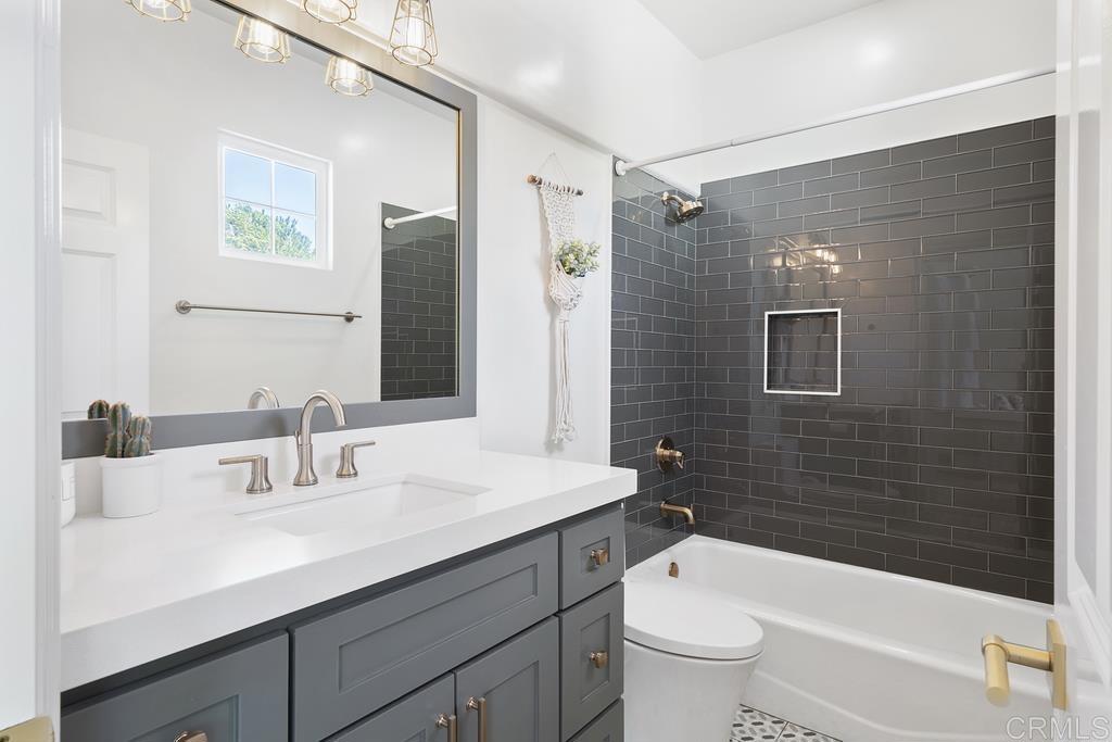 8 Corte Vizcaya San Clemente, CA 92673 - Photo 43 of 62 a bathroom with a sink a toilet and shower a mirror