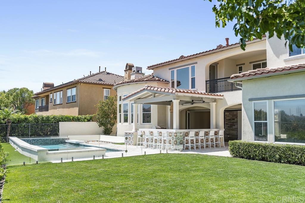 8 Corte Vizcaya San Clemente, CA 92673 - Photo 50 of 62 a front view of a house with a yard table and chairs