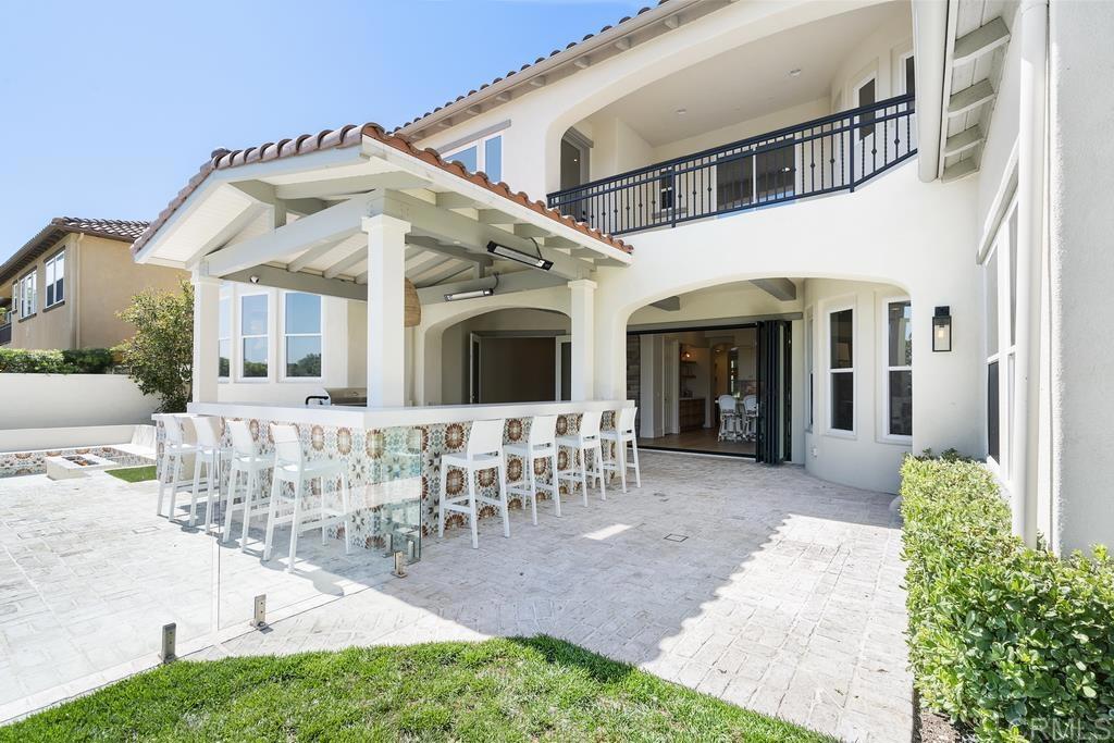 8 Corte Vizcaya San Clemente, CA 92673 - Photo 56 of 62 a wooden bench sitting in front of a building