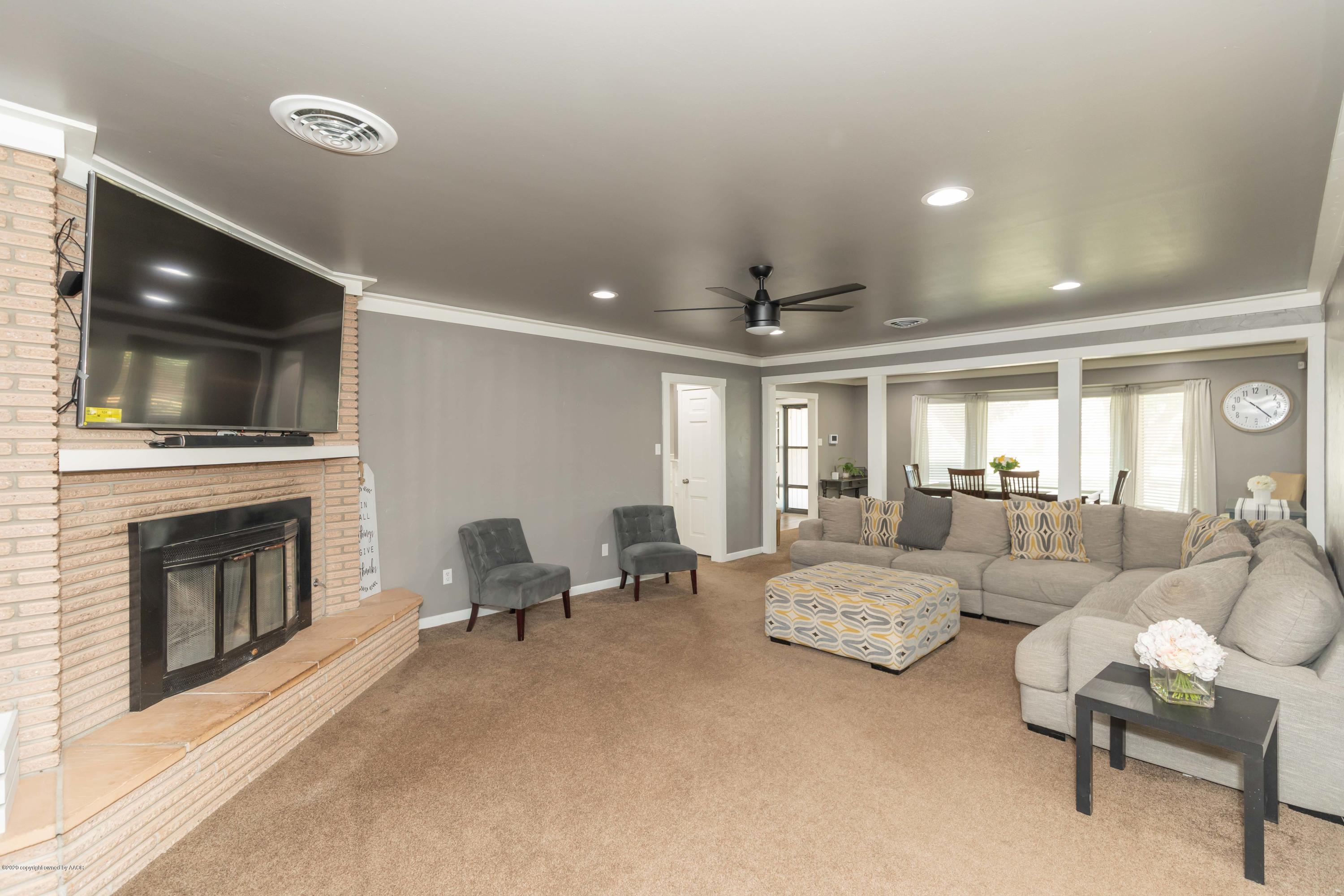 6710 Jameson Road Amarillo, TX 79106 - Photo 12 of 40 a living room with furniture and a fireplace