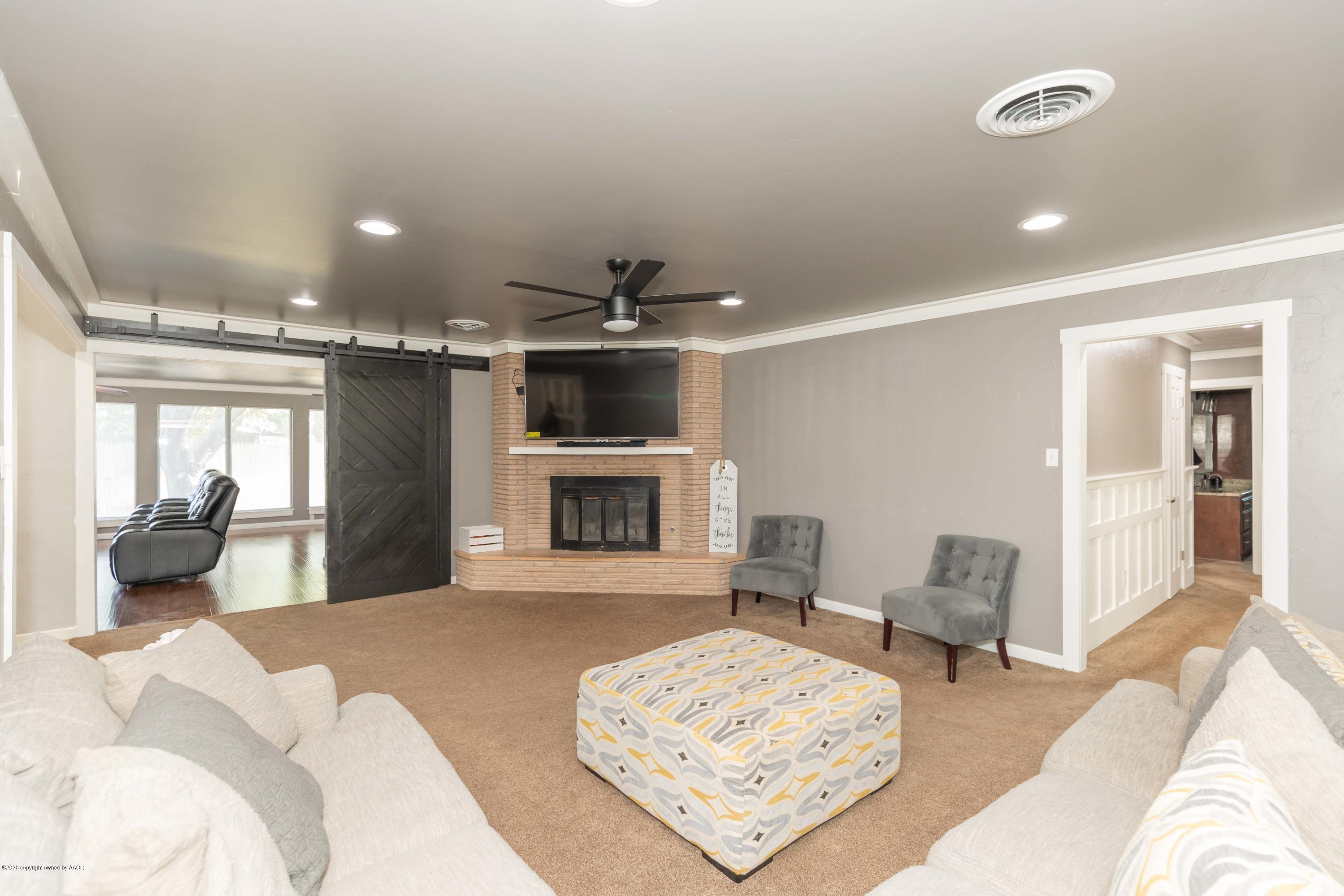 6710 Jameson Road Amarillo, TX 79106 - Photo 13 of 40 a living room with furniture and a fireplace