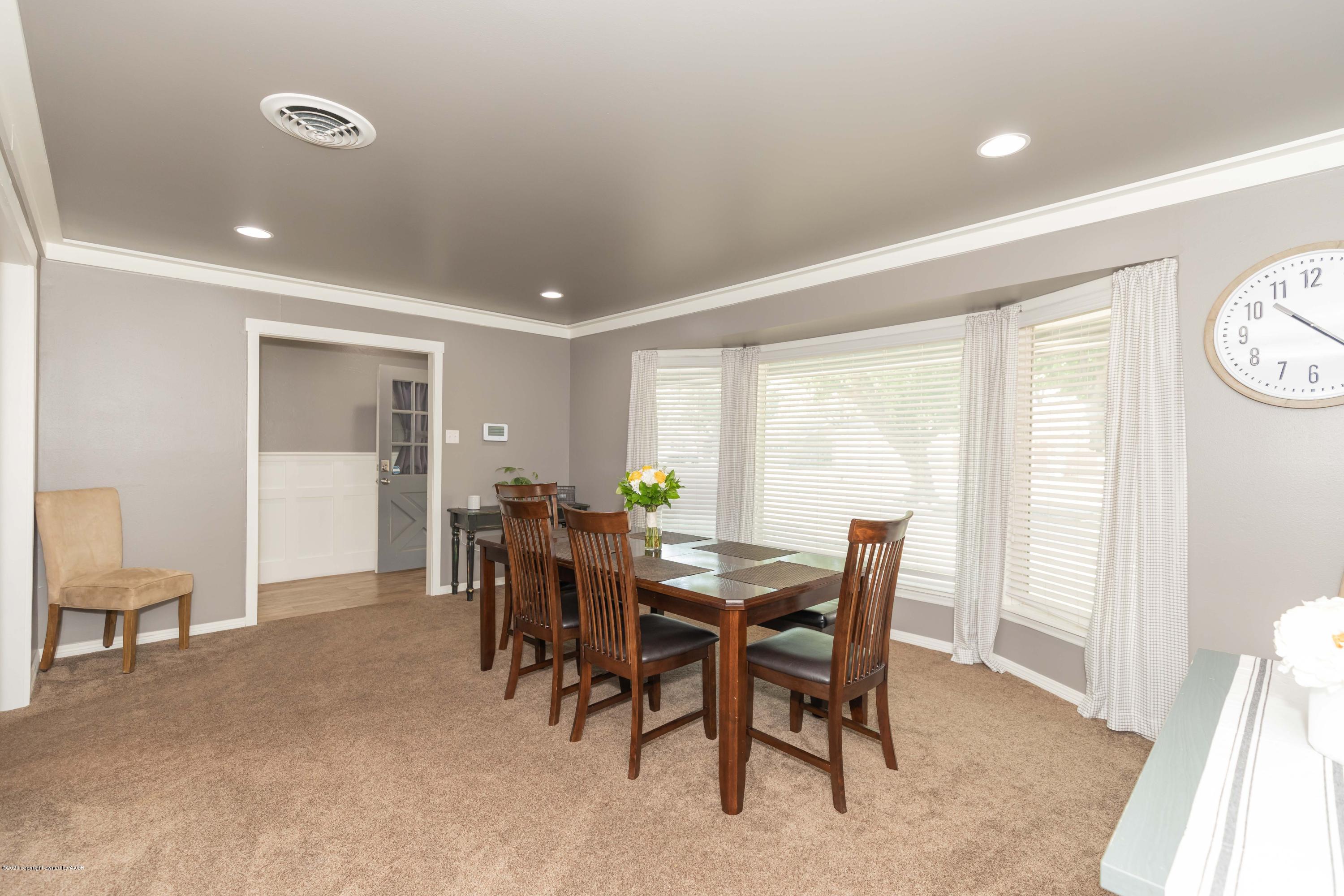 6710 Jameson Road Amarillo, TX 79106 - Photo 16 of 40 a view of a dining room with furniture and a window