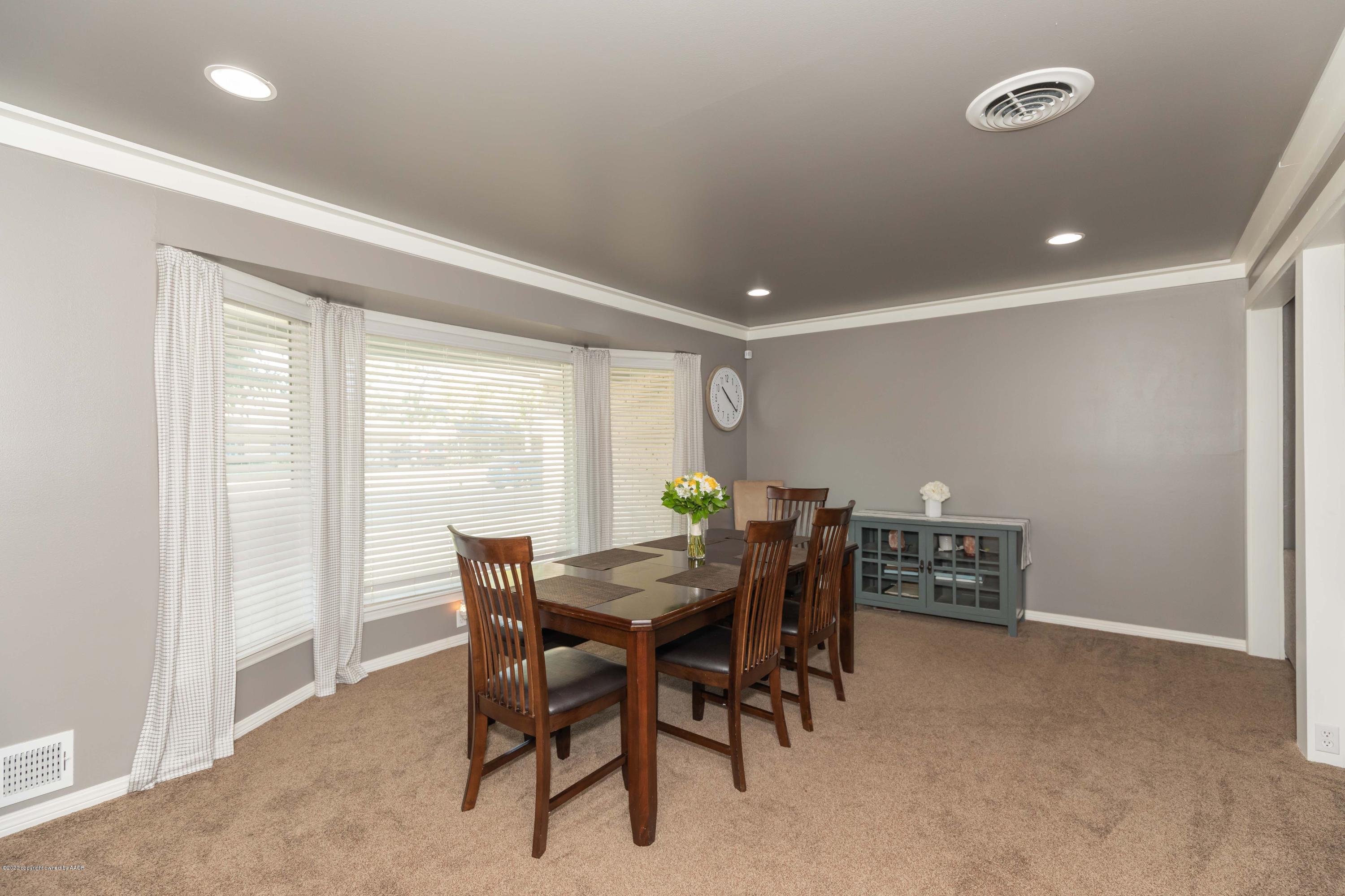 6710 Jameson Road Amarillo, TX 79106 - Photo 17 of 40 a view of a dining room with furniture and window
