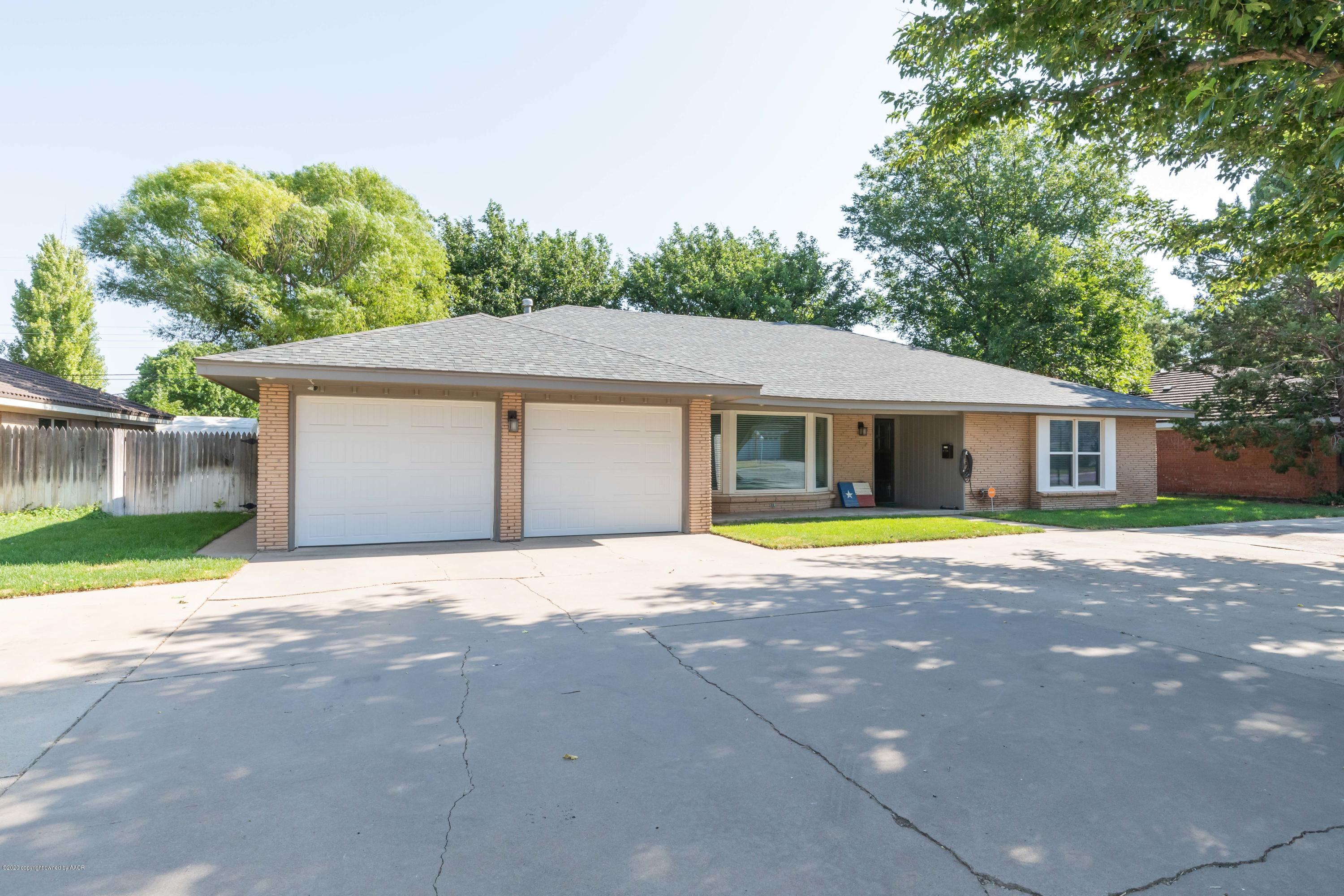 6710 Jameson Road Amarillo, TX 79106 - Photo 2 of 40 a house with trees in the background