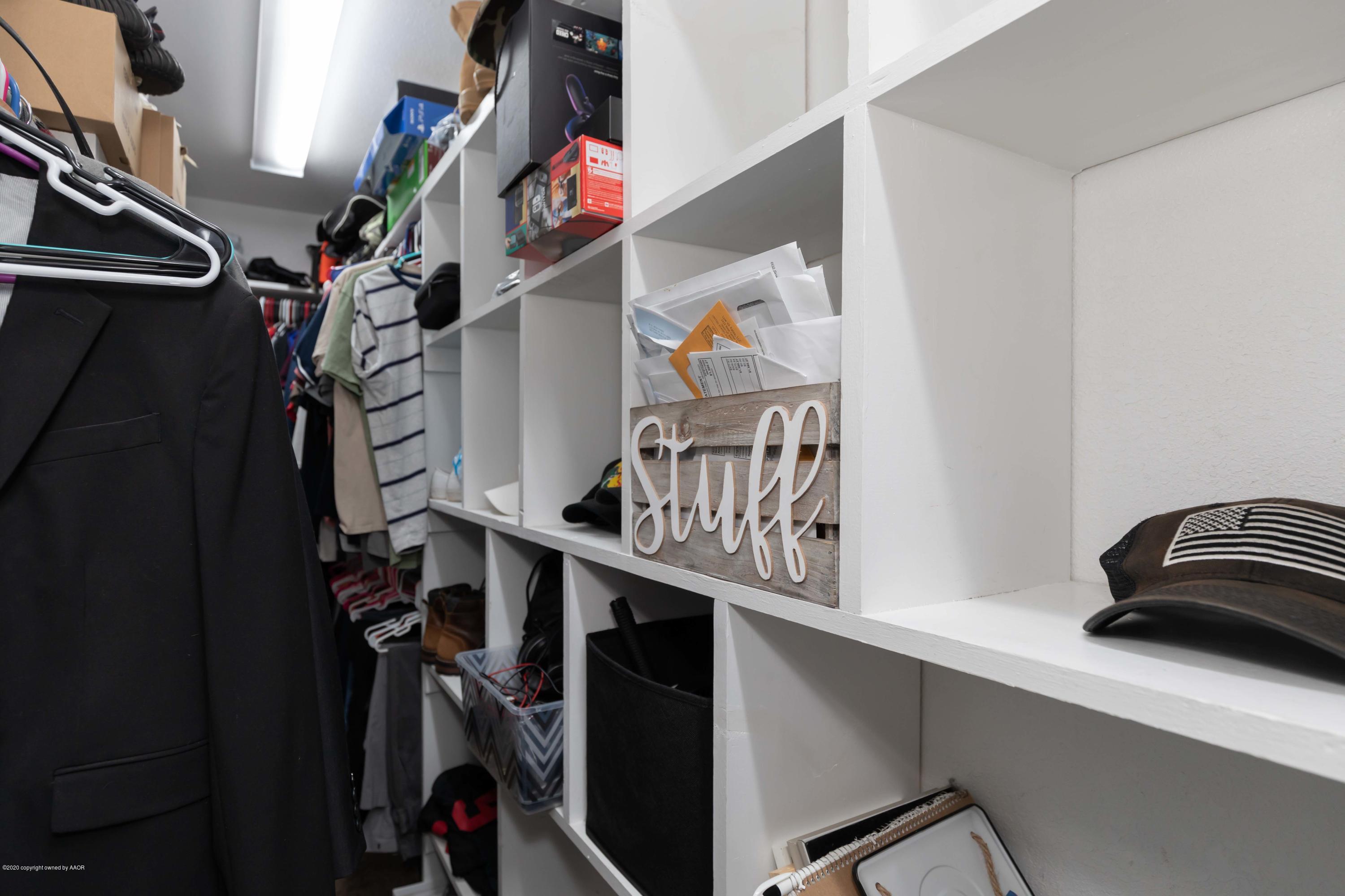 6710 Jameson Road Amarillo, TX 79106 - Photo 26 of 40 a view of walk in closet with clothes and shoes
