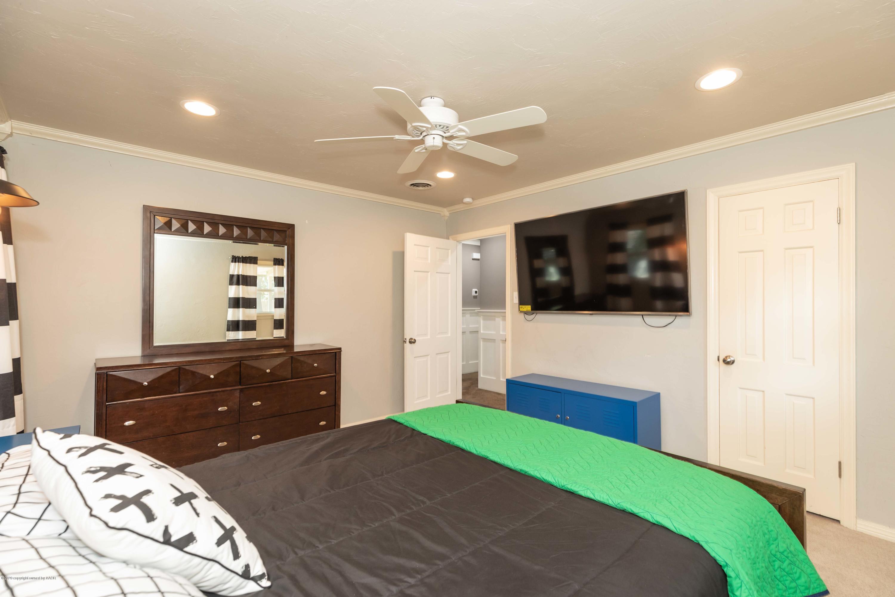 6710 Jameson Road Amarillo, TX 79106 - Photo 34 of 40 a bedroom with a bed and a dresser