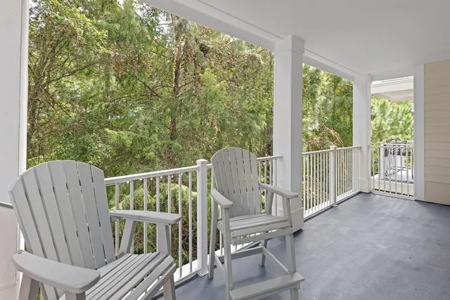 a view of balcony with furniture