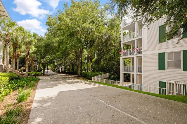 a view of a brick building next to a yard