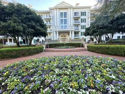 a kitchen with a refrigerator and a sink