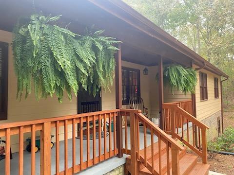 4470 East Fairview Road Southwest Stockbridge, GA 30281 - Photo 11 of 13 a view of a porch with furniture