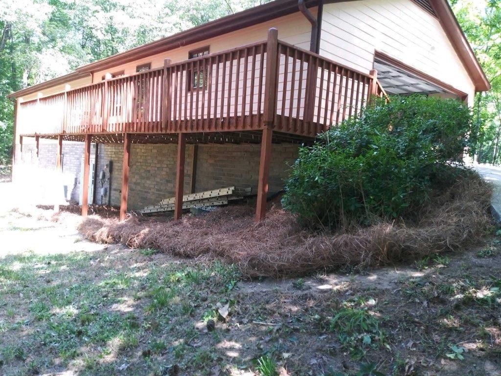 4470 East Fairview Road Southwest Stockbridge, GA 30281 - Photo 3 of 13 a view of a backyard with plants and large trees