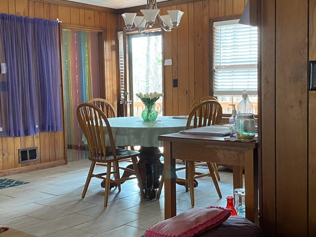 4470 East Fairview Road Southwest Stockbridge, GA 30281 - Photo 7 of 13 a view of a dining room with furniture and window