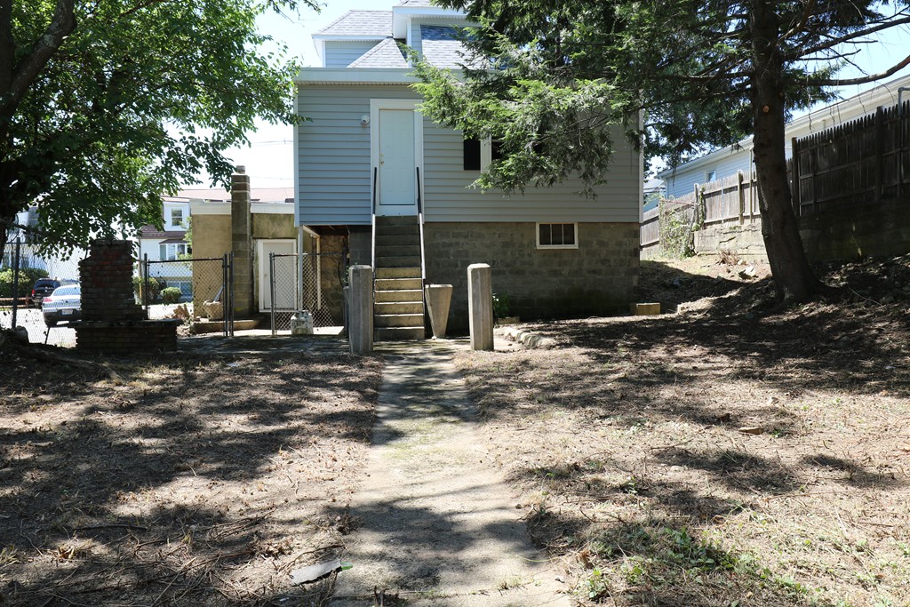 126 Fulton Spring Road Medford, MA 02155 - Photo 20 of 20 a view of a house with a yard