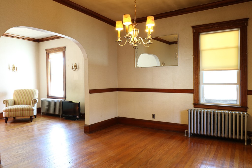126 Fulton Spring Road Medford, MA 02155 - Photo 7 of 20 a view of livingroom with furniture and wooden floor