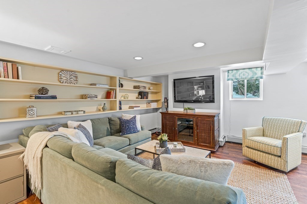 115 Conant Road Weston, MA 02493 - Photo 19 of 31 a living room with furniture and a fireplace