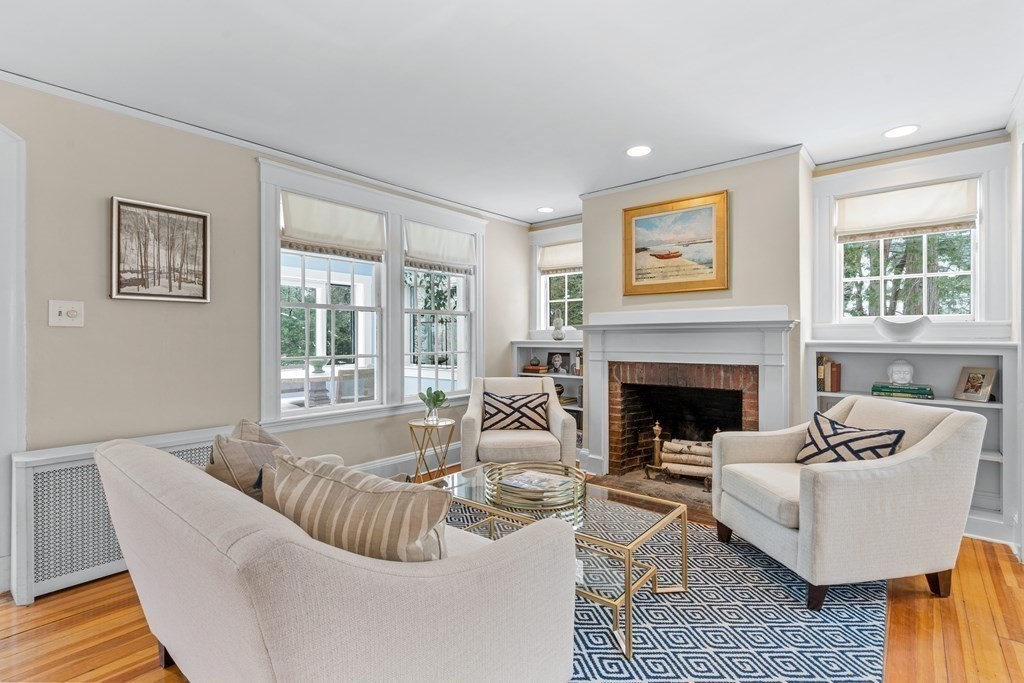115 Conant Road Weston, MA 02493 - Photo 3 of 31 a living room with furniture and a fireplace