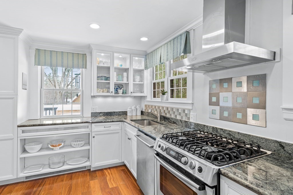 115 Conant Road Weston, MA 02493 - Photo 10 of 31 a kitchen with a stove a sink and a window