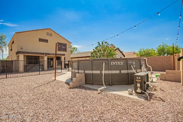 a view of a backyard with a sitting area