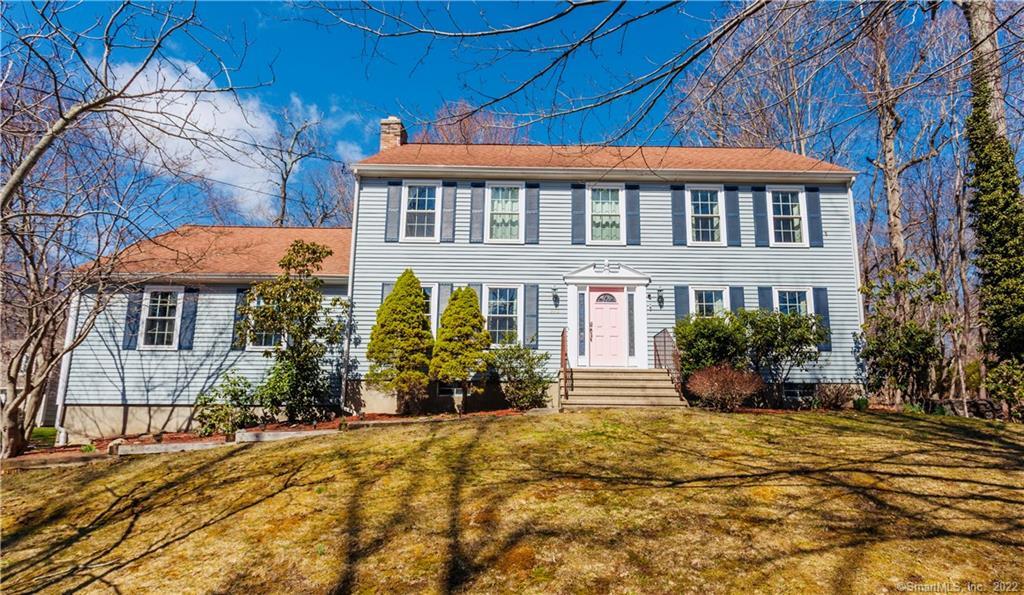 390 Purdy Hill Road Monroe, CT 06468 - Photo 1 of 1 a front view of a house with a yard