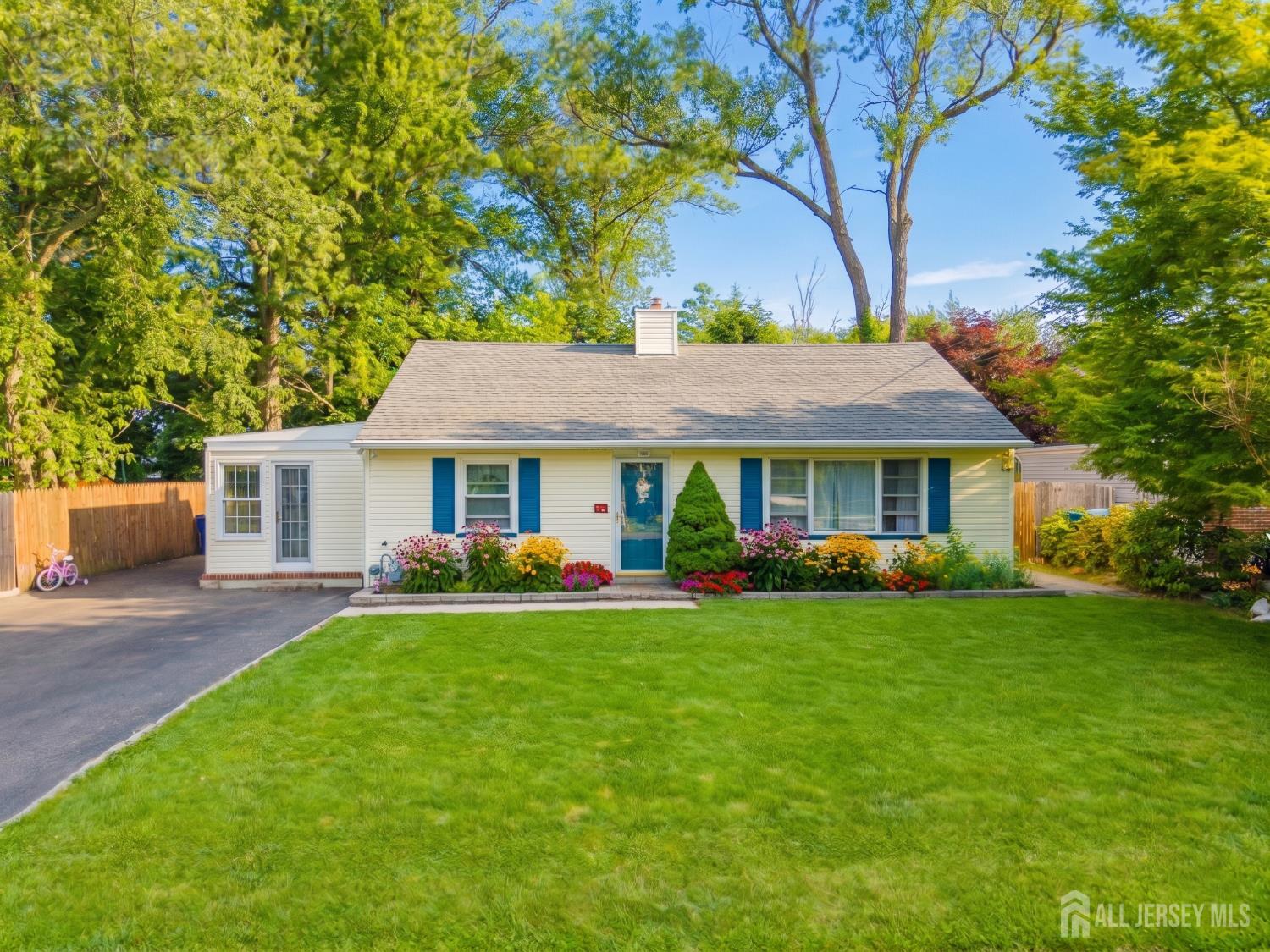 12 Pierrepont Avenue Middlesex, NJ 08846 - Photo 1 of 30 a front view of a house with a garden and trees