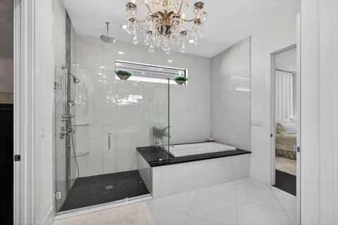 a spacious bathroom with a mirror sink and vanity