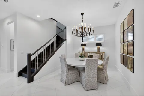 a kitchen with stainless steel appliances granite countertop a stove and a refrigerator