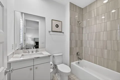 a utility room with sink dryer and washer