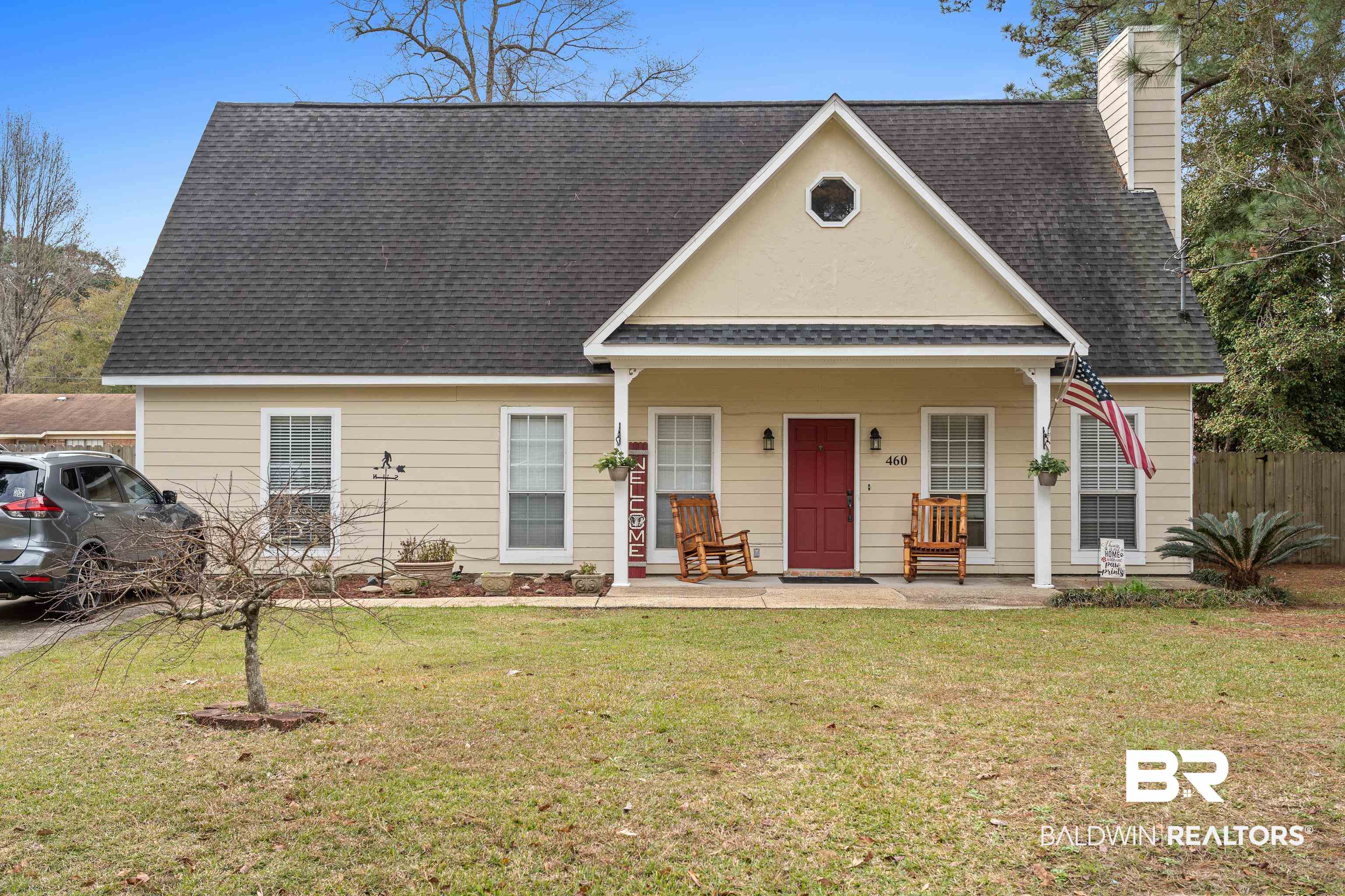 460 Ridgewood Drive Daphne, AL 36526 - Photo 1 of 31 View of front of property featuring a front yard and a porch