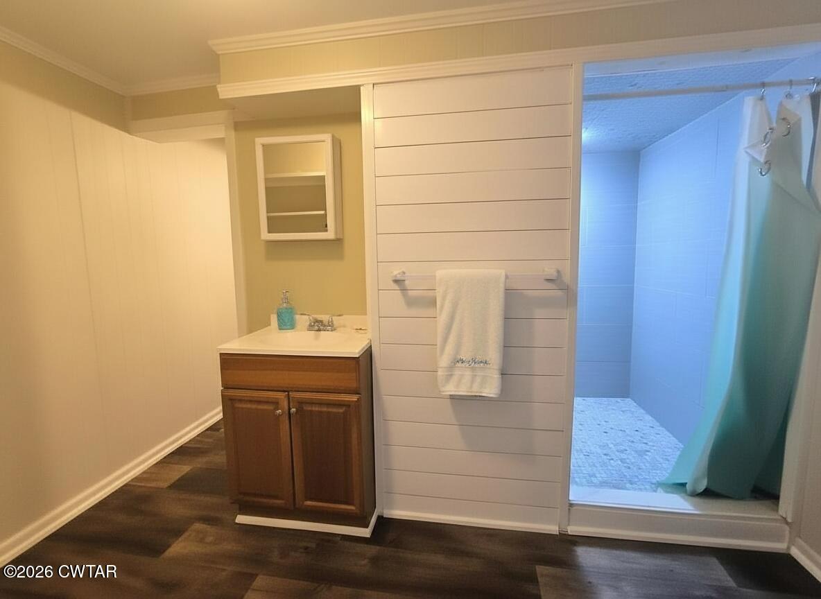 513 Viar Road Dyersburg, TN 38024 - Photo 33 of 37 a bathroom with a sink and a mirror