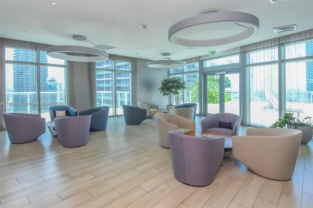 a living room with lots of furniture and a table