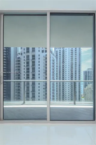 a view of empty room with windows