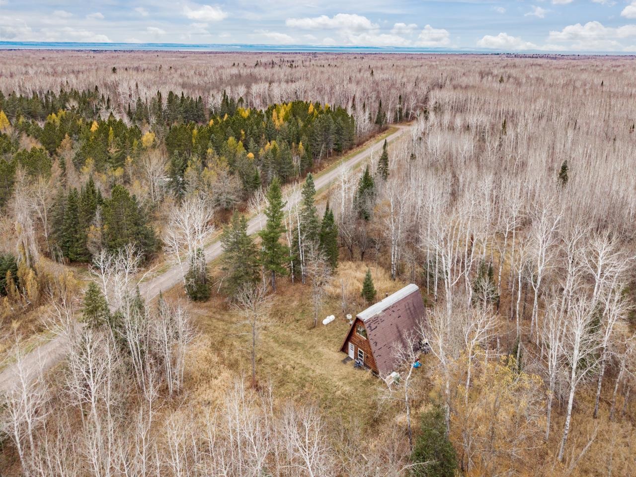 2040 Green Acres Road Maple, WI 54854 - Photo 1 of 19 Aerial view of a heavily wooded area