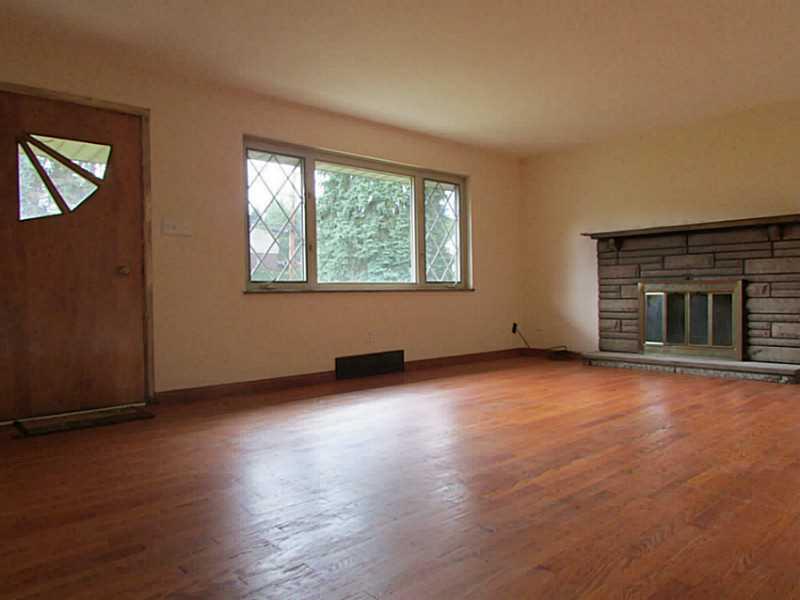 105 Grace Street McKees Rocks, PA 15136 - Photo 3 of 12 Living Room. Gleaming Hardwoods In This Large Living Room With Wood Burning Fireplace!