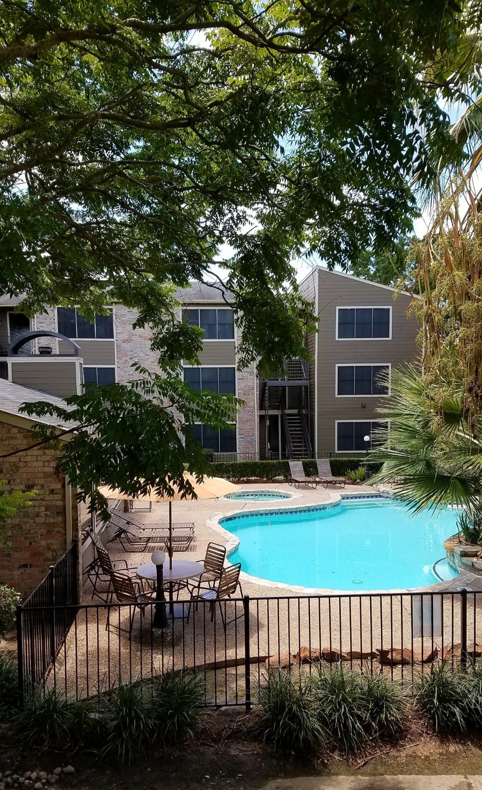10250 Lands End Drive, Unit 1010 Houston, TX 77099 - Photo 21 of 27 a view of a house with backyard and sitting area