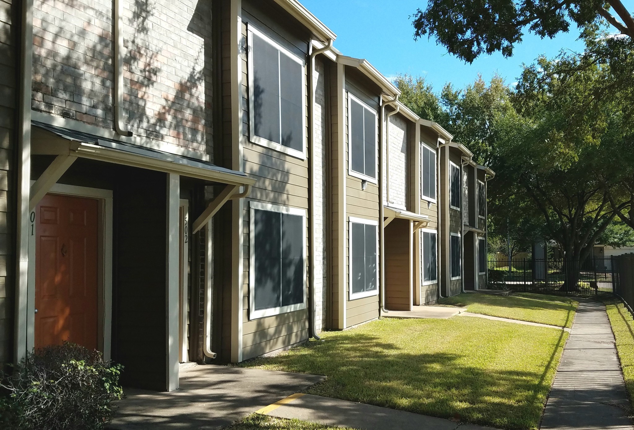 10250 Lands End Drive, Unit 1010 Houston, TX 77099 - Photo 23 of 27 a view of a house with backyard stairs and garden