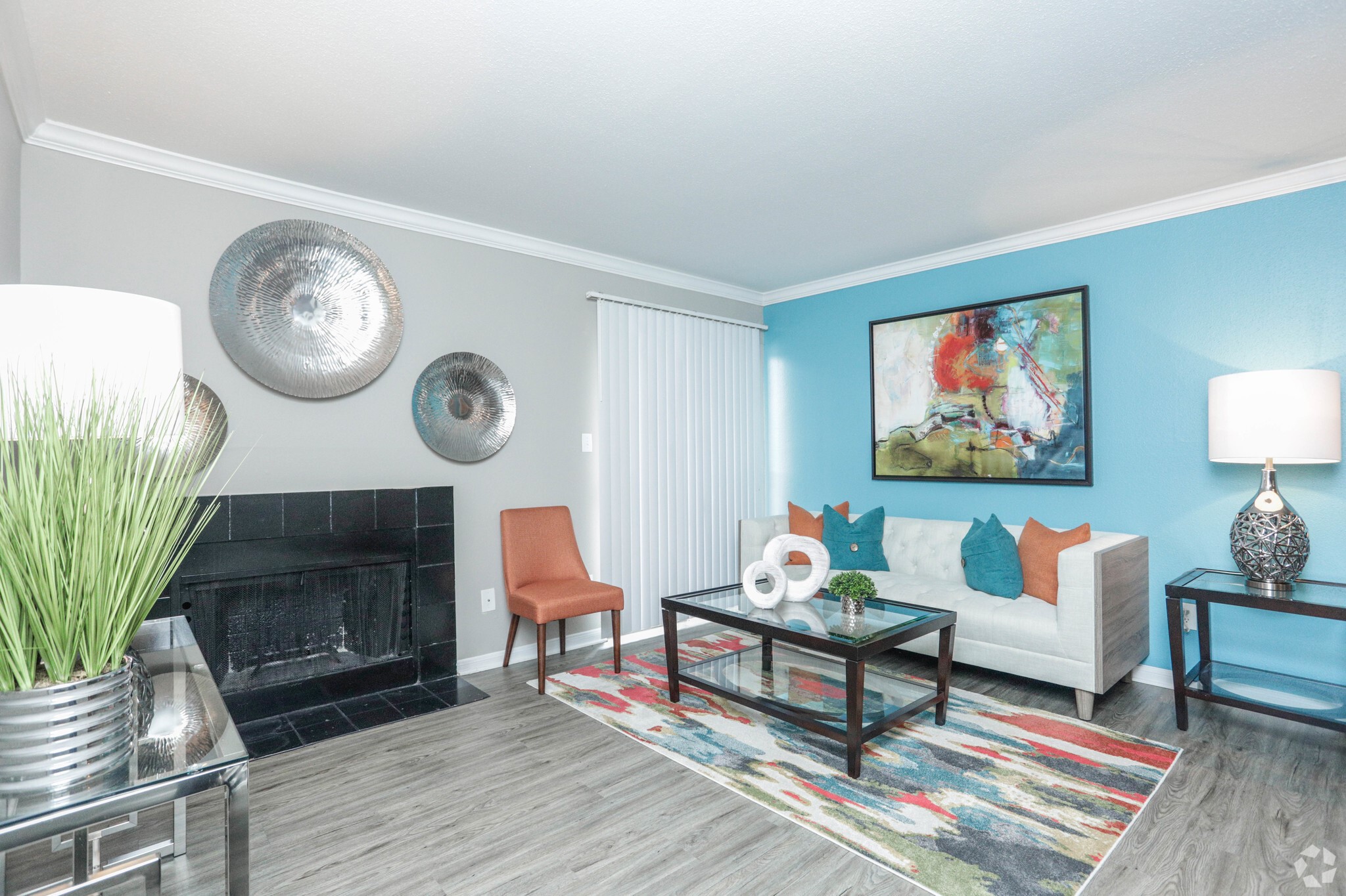 10250 Lands End Drive, Unit 1010 Houston, TX 77099 - Photo 3 of 27 a living room with furniture a rug and a wall painting