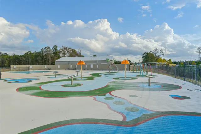 a view of a swimming pool with a yard