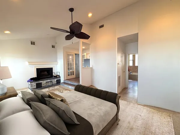 a bedroom with a bed and a television