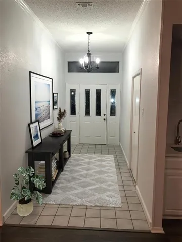 a view of a hallway with wooden floor and workspace